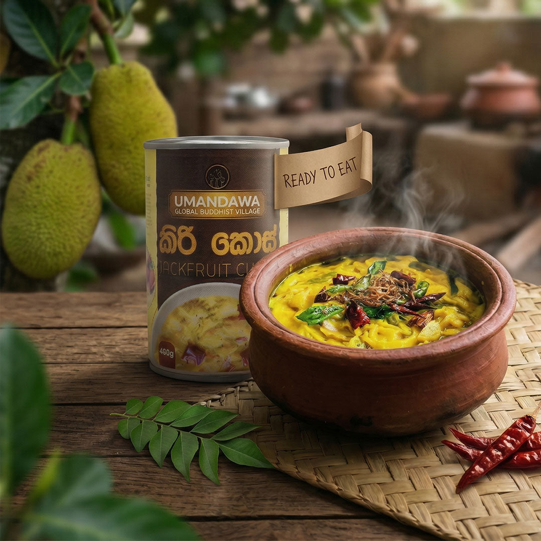 Steaming jackfruit curry in clay pot with canned jackfruit curry and fresh jackfruit in background